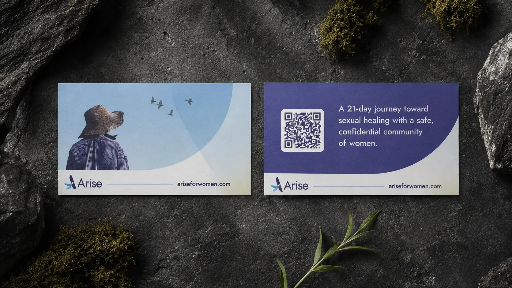 The Arise resource card, front and back, on dark stone: a woman looking up at birds in flight, and a reverse describing a 21-day journey toward sexual healing in a confidential community of women.